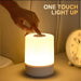 Minimalist touch-controlled rechargeable LED night lamp on bedside table