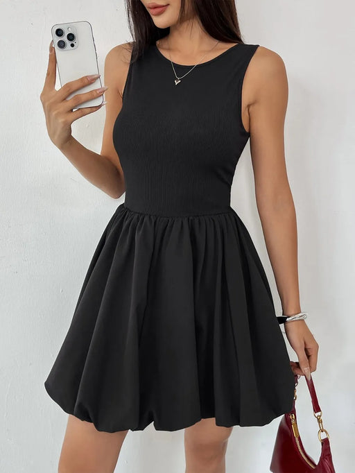 Woman wearing a ruched bodycon dress in a fitted, opaque, sleeveless design