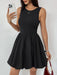 Woman wearing a ruched bodycon dress in a fitted, opaque, sleeveless design