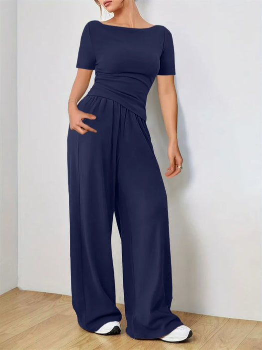 Woman wearing a two-piece lounge set made of soft, slightly stretchy fabric in a relaxed fit