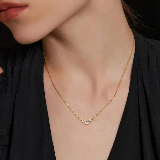 Close-up of a 0.5 carat Moissanite pendant necklace with a gold-plated chain on display

