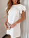 Woman wearing a ruffled backless summer dress in a lightweight, breathable fabric

