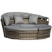 4-piece outdoor rattan daybed set with canopy and cushions on a garden patio

