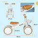  Brown and white toddler balance bike with enclosed wheels and adjustable seat