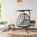 Double rattan swing chair with canopy, cushions, and steel frame for outdoor garden or patio use

