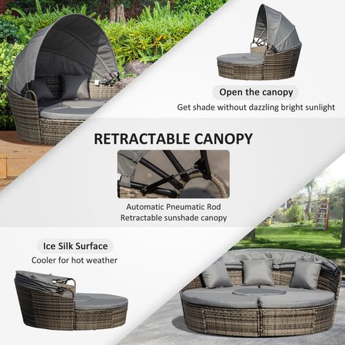 4-piece outdoor rattan daybed set with canopy and cushions on a garden patio

