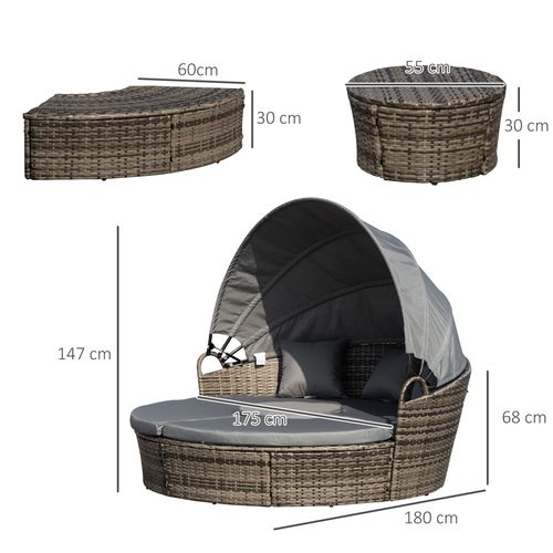4-piece outdoor rattan daybed set with canopy and cushions on a garden patio


