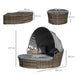 4-piece outdoor rattan daybed set with canopy and cushions on a garden patio

